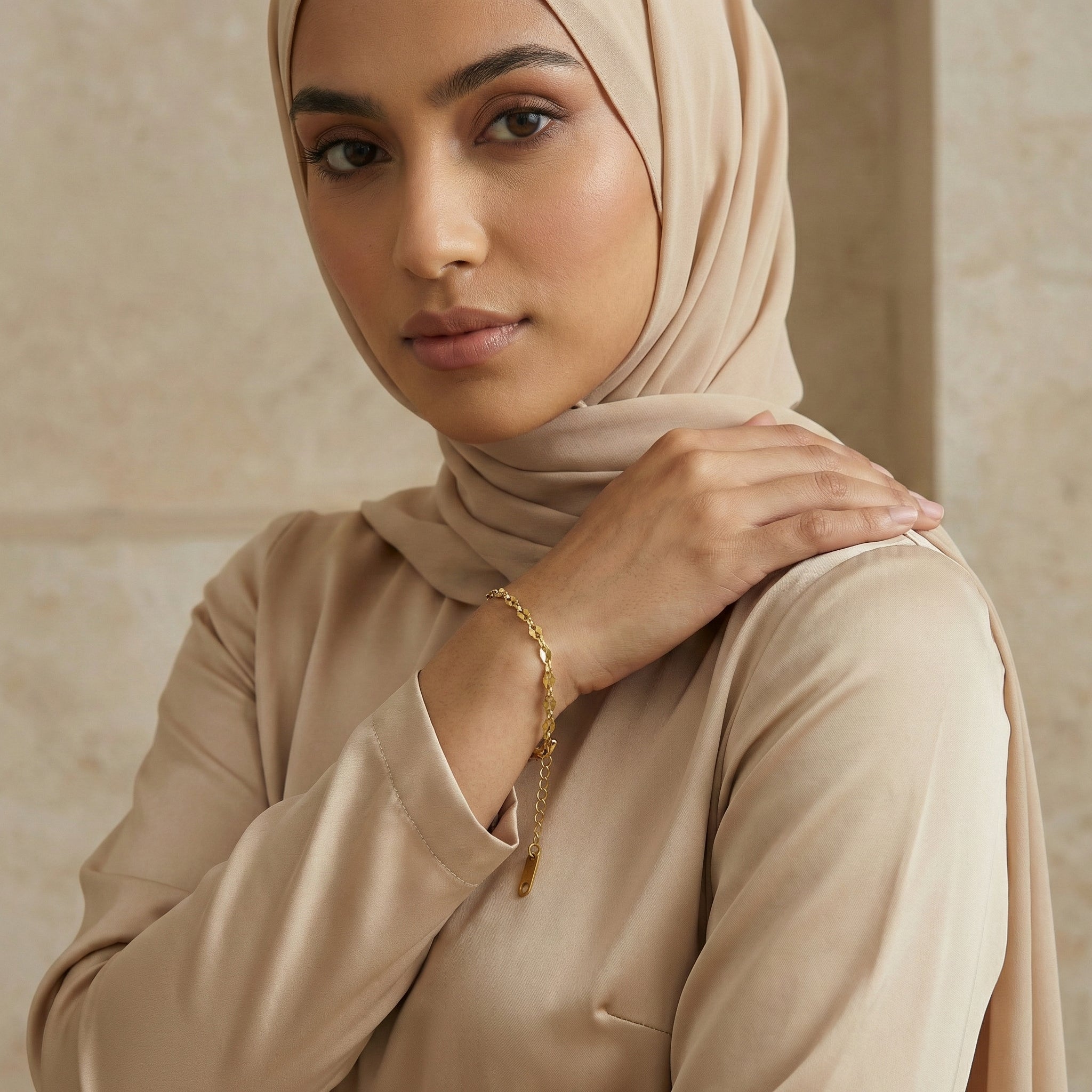 Woman wearing a gold bracelet